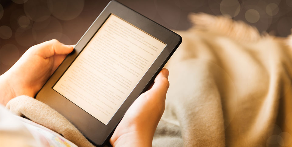Person using an e-reader to read book